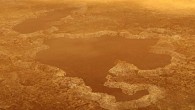This artist’s concept of a lake at the north pole of Titan illustrates raised rims and rampartlike features such as those seen by NASA’s Cassini spacecraft around the moon’s Winnipeg Lacus. New research using Cassini radar data and modeling proposes that lake basins like these are likely explosion craters, which could have formed when liquid molecular nitrogen deposits within the crust warmed and quickly turned to vapor, blowing holes in the moon’s crust. This would have happened during a warming event (or events) that occurred in a colder, nitrogen-dominated period in Titan’s past. The study may provide evidence of these cold periods in Titan’s past, followed by a relative warming to conditions like those of today. Although Titan is frigid compared to Earth, methane in the atmosphere provides a greenhouse effect that warms the moon’s surface. Image credit: NASA / JPL-Caltech.