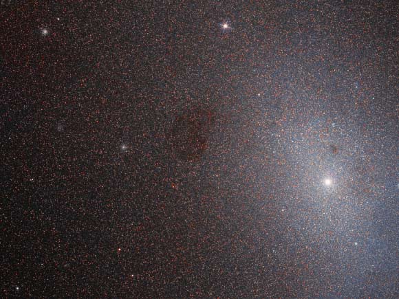 This Hubble image reveals a detailed view of part of the dwarf elliptical galaxy Messier 110. The color image was made from separate exposures taken in the visible and near-infrared regions of the spectrum with Hubble’s Wide Field Planetary Camera 2 (WFPC2). It is based on data obtained through two filters. The color results from assigning different hues to each monochromatic image associated with an individual filter. Image credit: NASA / ESA / Hubble / L. Ferrarese et al.