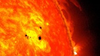 NASA’s Solar Dynamics Observatory (SDO) captured this image of the Sun with sunspots in February 2013. The picture combines images from two SDO instruments: the Helioseismic and Magnetic Imager (HMI), which takes pictures in visible light that show sunspots, and the Advanced Imaging Assembly (AIA), which took an image in the 304 angstrom wavelength showing the lower atmosphere of the Sun, which is colorized in red. Image credit: NASA / SDO / AIA / HMI / Goddard Space Flight Center.