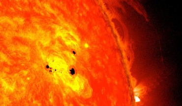NASA’s Solar Dynamics Observatory (SDO) captured this image of the Sun with sunspots in February 2013. The picture combines images from two SDO instruments: the Helioseismic and Magnetic Imager (HMI), which takes pictures in visible light that show sunspots, and the Advanced Imaging Assembly (AIA), which took an image in the 304 angstrom wavelength showing the lower atmosphere of the Sun, which is colorized in red. Image credit: NASA / SDO / AIA / HMI / Goddard Space Flight Center.