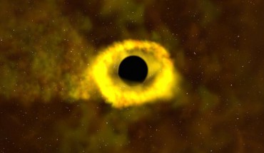 When a star strays too close to a black hole, intense tides break it apart into a stream of gas. The tail of the stream escapes the system, while the rest of it swings back around, surrounding the black hole with a disk of debris. Image credit: NASA’s Goddard Space Flight Center.