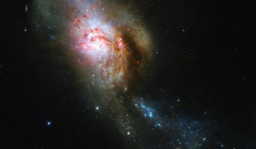 This Hubble image shows NGC 4194, an ongoing cosmic collision between two galaxies. This picture was snapped by Hubble’s Wide Field Camera 3 (WFC3). The image was made through four filters. The color results from assigning different hues to each monochromatic image associated with an individual filter. Image credit: NASA / ESA / Hubble / A. Adamo.