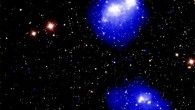This composite image shows Abell 1758, a quadruple galaxy cluster system about 3 billion light-years away from Earth. In the northern (top) pair seen in the image, the centers of each cluster have already passed by each other once, about 300 to 400 million years ago, and will eventually swing back around. The southern pair at the bottom of the image has two clusters that are close to approaching each other for the first time. X-rays from Chandra are shown as blue and white, depicting fainter and brighter diffuse emission, respectively. This image also includes an optical image from the Sloan Digital Sky Survey (SDSS). Image credit: NASA / CXC / SAO / G. Schellenberger et al / SDSS.