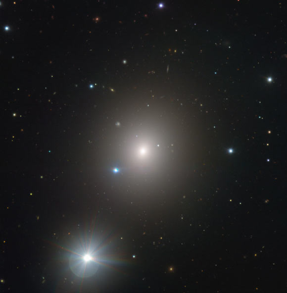 ESO’s Very Large Telescope captured this image of NGC 1404 with its FORS (FOcal Reducer and low dispersion Spectrograph) instrument; the bright foreground star to the lower left of the frame is named HD 22862. Image credit: ESO.