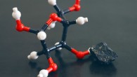 A model of the molecular structure of ribose and an image of the Murchison meteorite. Image credit: Yoshihiro Furukawa.