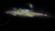 NGC 4631 is seen edge-on, with its disk of stars shown in pink; the filaments, shown in green and blue, extend beyond the disk into the galaxy’s extended halo; green indicates filaments with their magnetic field pointing roughly toward us and blue with the field pointing away; this phenomenon, with the field alternating in direction, has never before been seen in the halo of a galaxy. This VLA image shows a companion galaxy -- a small elliptical galaxy called NGC 4627 -- just above NGC 4631. Image credit: Jayanne English, University of Manitoba / Silvia Carolina Mora-Partiarroyo & Marita Krause of the Max-Planck Institute for Radioastronomy / Maria Patterson & Rene Walterbos, New Mexico State University / Arpad Miskolczi, University of Bochum / NRAO.