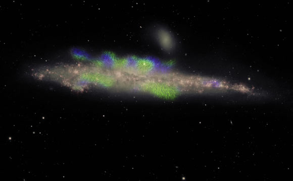 NGC 4631 is seen edge-on, with its disk of stars shown in pink; the filaments, shown in green and blue, extend beyond the disk into the galaxy’s extended halo; green indicates filaments with their magnetic field pointing roughly toward us and blue with the field pointing away; this phenomenon, with the field alternating in direction, has never before been seen in the halo of a galaxy. This VLA image shows a companion galaxy -- a small elliptical galaxy called NGC 4627 -- just above NGC 4631. Image credit: Jayanne English, University of Manitoba / Silvia Carolina Mora-Partiarroyo & Marita Krause of the Max-Planck Institute for Radioastronomy / Maria Patterson & Rene Walterbos, New Mexico State University / Arpad Miskolczi, University of Bochum / NRAO.