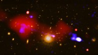 This composite image shows the surroundings of a supermassive black hole that is triggering star formation across the longest distance ever seen; as hot gas swirls around the black hole, it emits large amounts of X-rays that Chandra detects; the black hole is also the source of radio-wave emission from a jet of high-energy particles -- previously detected by scientists with the VLA -- that stretches about a million light-years. Image credit: NASA / CXC / INAF / R. Gilli et al / NRAO / VLA / STScI.