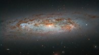 NGC 3175 can be seen slicing across the frame in this Hubble image, with its mix of bright patches of glowing gas, dark lanes of dust, bright core, and whirling, pinwheeling arms coming together to paint a beautiful celestial scene. This image is made up of observations from Hubble’s Wide Field Camera 3 (WFC3) in the infrared and optical parts of the spectrum. Two filters were used to sample various wavelengths. The color results from assigning different hues to each monochromatic image associated with an individual filter. Image credit: NASA / ESA / Hubble / D. Rosario et al.