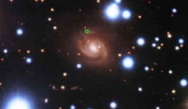 This image from the 8-m Gemini North telescope shows SDSS J015800.28+654253.0 (center), the host galaxy of FRB 180916 (green circle). Image credit: Gemini Observatory / NSF’s National Optical-Infrared Astronomy Research Laboratory / AURA.