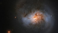 This Hubble image shows NGC 1022, a face-on barred spiral galaxy located in the constellation of Cetus, approximately 62 million light-years away. The image is made up of observations from Hubble’s Wide Field Camera 3 (WFC3) in the infrared and optical parts of the spectrum. Three filters were used to sample various wavelengths. The color results from assigning different hues to each monochromatic image associated with an individual filter. Image credit: NASA / ESA / Hubble / A. Seth.