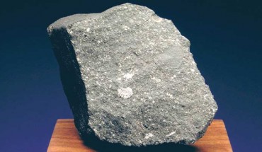 Curious Marie is a sample of the Allende meteorite, which fell in northern Mexico in February 1969. The white, fuzzy-looking features in this fragment are calcium-aluminum-rich inclusions -- some of the first solids to condense in the Solar System. Image credit: The Planetary Society.