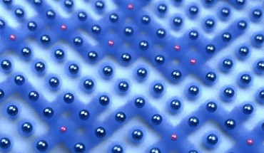 An artist’s impression of the dissolving of the electronic ‘traffic jam:’ the red atoms are different in their quantum nature and allow transport of electrons in their surroundings. Image credit: Berend Zwartsenberg.