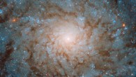 This Hubble image shows the central region of the spiral galaxy NGC 4689. The color image was made from separate exposures taken in the visible and infrared regions of the spectrum with Hubble’s Wide Field Camera 3 (WFC3). It is based on data obtained through three filters. The color results from assigning different hues to each monochromatic image associated with an individual filter. Image credit: NASA / ESA / Hubble.