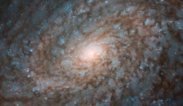 This Hubble image shows the flocculent spiral galaxy NGC 4237. The image is made up of observations from Hubble’s Wide Field Camera 3 (WFC3) instrument in the infrared and optical parts of the spectrum. Three filters were used to sample various wavelengths. The color results from assigning different hues to each monochromatic image associated with an individual filter. Image credit: NASA / ESA / Hubble / P. Erwin et al.