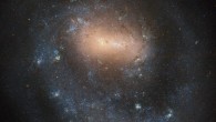 This Hubble image shows the barred spiral galaxy NGC 4618. The color image was made from separate exposures taken in the visible and near-infrared regions of the spectrum with Hubble’s Wide Field Camera 3 (WFC3) and Advanced Camera for Surveys (ACS) instruments. Three filters were used to sample various wavelengths. The color results from assigning different hues to each monochromatic image associated with an individual filter. Image credit: NASA / ESA / Hubble / I. Karachentsev.