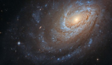 This Hubble image shows the spiral galaxy NGC 4651. The color image was made from separate exposures taken in the visible and near-infrared regions of the spectrum with Hubble’s Advanced Camera for Surveys (ACS) instrument. Two filters were used to sample various wavelengths. The color results from assigning different hues to each monochromatic image associated with an individual filter. Image credit: NASA / ESA / Hubble / D. Leonard.