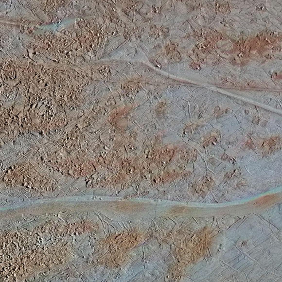 This image shows chaos terrain where blocks of material have shifted, rotated, tilted and refrozen. Scientists use this as a puzzle for clues about how the surface has changed. The area is called Chaos Near Agenor Linea for its proximity to the wide band of that name at the bottom of the image. Image credit: NASA / JPL-Caltech / SETI Institute.
