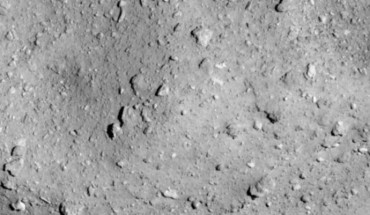 Hayabusa-2 image of the asteroid Ryugu as seen from a distance of 3.7 miles. A particularly large crater is visible near the center of the image. Image credit: JAXA / University of Tokyo / Kochi University / Rikkyo University / Nagoya University / Chiba Institute of Technology / Meiji University / University of Aizu / AIST.