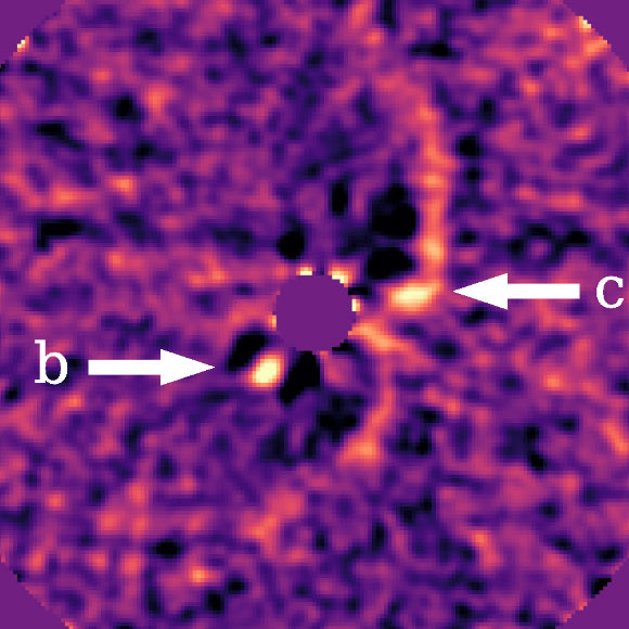 This image shows protoplanets PDS 70b and PDS 70c (labeled with white arrows) with the circumstellar disk removed. Image credit: J. Wang, Caltech.