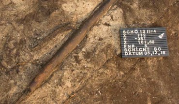 The 300,000-year-old wooden throwing stick at Schöningen 13 II-4, Germany. Image credit: Alexander Gonschior.