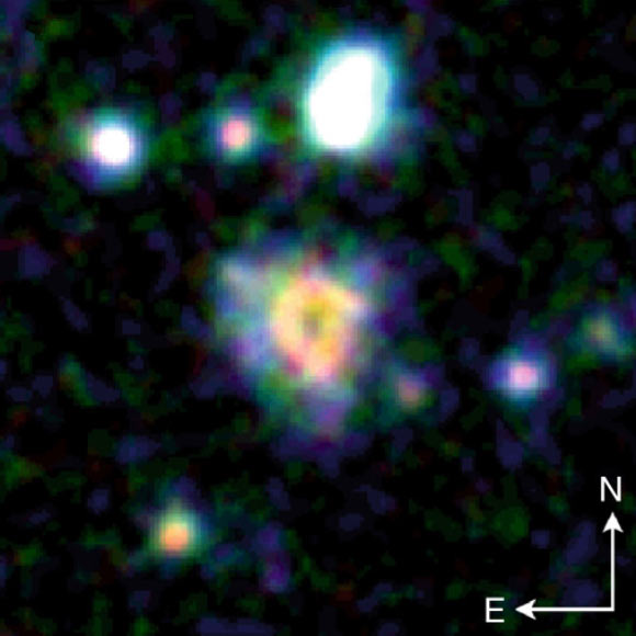 A composite image of the collisional ring galaxy R5519 and its environment compiled from Hubble and ZFOURGE images. Image credit: Tiantian Yuan / NASA / ESA / Hubble / ZFOURGE.