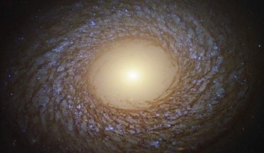 This Hubble image shows a flocculent spiral galaxy called NGC 2775. The image was made from separate exposures taken in the visible, ultraviolet and near-infrared regions of the spectrum with Hubble’s Wide Field Camera 3 (WFC3). It is based on data obtained through five filters. The color results from assigning different hues to each monochromatic image associated with an individual filter. Image credit: NASA / ESA / Hubble / J. Lee / PHANGS-HST Team / Judy Schmidt, www.geckzilla.com.