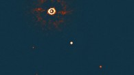This image, captured by the SPHERE instrument on ESO’s Very Large Telescope, shows TYC 8998-760-1 accompanied by two giant planets, TYC 8998-760-1b and TYC 8998-760-1c. The two planets are visible as two bright dots in the center (TYC 8998-760-1b) and bottom right (TYC 8998-760-1c) of the frame. Other bright dots, which are background stars, are visible in the image as well. Image credit: ESO / Bohn et al.