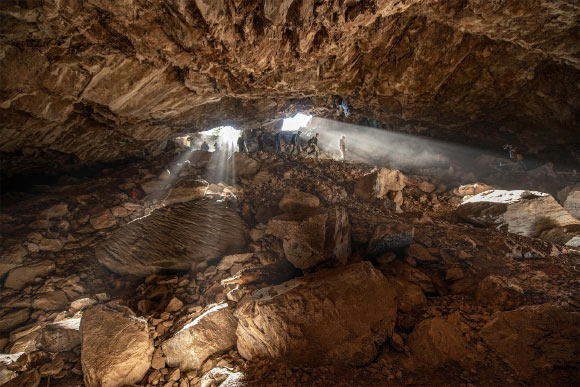Team members entering Chiquihuite Cave, Mexico. Image credit: Devlin A. Gandy.