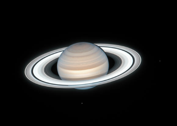 Hubble captured this image of Saturn and its rings on July 4, 2020. Two of Saturn’s icy moons are clearly visible in this image: Mimas (right) and Enceladus (bottom). Image credit: NASA / ESA / A. Simon, NASA’s Goddard Space Flight Center / M.H. Wong, University of California, Berkeley / OPAL Team.