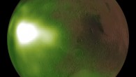 This image shows the ultraviolet nightglow in the Martian atmosphere. Green and white false colors represent the intensity of ultraviolet light, with white being the brightest. The nightglow was measured at about 70 km altitude by the Imaging UltraViolet Spectrograph instrument on NASA’s MAVEN spacecraft. A simulated view of the Mars globe is added digitally for context. The image shows an intense brightening in Mars’ nightside atmosphere. The brightenings occur regularly after sunset on Martian evenings during fall and winter seasons, and fade by midnight. The brightening is caused by increased downwards winds which enhance the chemical reaction creating nitric oxide which causes the glow. Image credit: NASA / MAVEN / NASA’s Goddard Space Flight Center / CU / LASP.