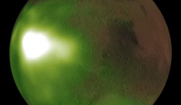 This image shows the ultraviolet nightglow in the Martian atmosphere. Green and white false colors represent the intensity of ultraviolet light, with white being the brightest. The nightglow was measured at about 70 km altitude by the Imaging UltraViolet Spectrograph instrument on NASA’s MAVEN spacecraft. A simulated view of the Mars globe is added digitally for context. The image shows an intense brightening in Mars’ nightside atmosphere. The brightenings occur regularly after sunset on Martian evenings during fall and winter seasons, and fade by midnight. The brightening is caused by increased downwards winds which enhance the chemical reaction creating nitric oxide which causes the glow. Image credit: NASA / MAVEN / NASA’s Goddard Space Flight Center / CU / LASP.