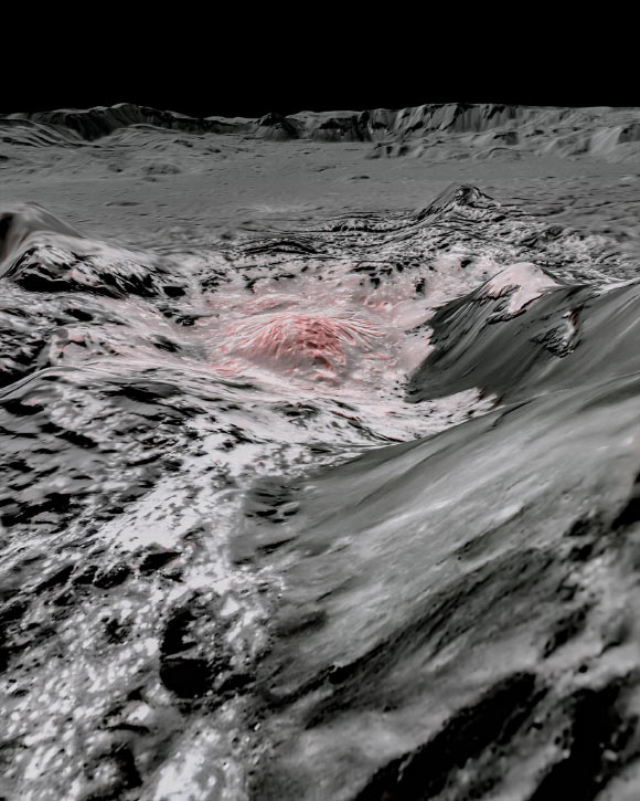 Dawn captured pictures in visible and infrared wavelengths, which were combined to create this false-color view of a region in 92-km- (57-mile-) wide Occator crater on the dwarf planet Ceres. Recently exposed brine in the center of the crater was pushed up from a deep reservoir below Ceres’ crust. In this view, it appears reddish. In the foreground, is Cerealia Facula, a 15-km- (9-mile-) wide region with a composition dominated by salts. The central dome, Cerealia Tholus, is about 3 km (1.9 miles) across at its base and 340 m (1,100 feet) tall. The dome is inside a central depression about 900 m (3,000 feet) deep. The area depicted in this scene is about 2.1 km (1.3 miles) wide in the foreground, about 11 km (7 miles) wide across the dome, and 56 km (35 miles) wide in the background, where the crater rim rises against the black sky. The distance from the near point (at the bottom) to the far point (at the top) is about 52 km (32 miles). Image credit: NASA / JPL-Caltech / UCLA / MPS / DLR / IDA.