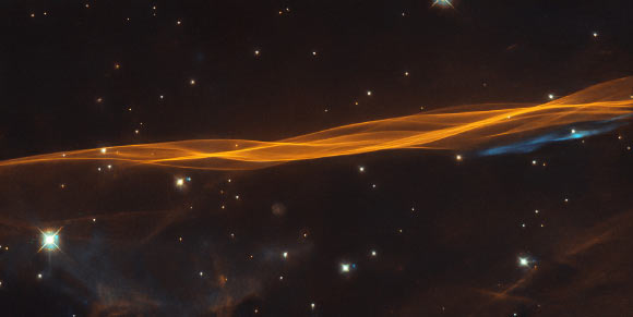 This Hubble image shows a small portion of the Cygnus Loop, a donut-shaped nebula located 2,400 light-years away in the constellation of Cygnus. Image credit: NASA / ESA / Hubble / W. Blair / Leo Shatz.
