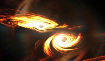 An artist’s impression of binary black holes about to collide. Image credit: Mark Myers, ARC Centre of Excellence for Gravitational Wave Discovery (OzGrav), Australian National University.