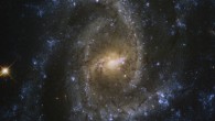 This Hubble image shows NGC 2835, an intermediate spiral galaxy approximately 28.5 million light-years away in the constellation of Hydra. The color image was made from separate exposures taken in the ultraviolet, visible and near-infrared regions of the spectrum with Hubble’s Wide Field Camera 3 (WFC3). It is based on data obtained through five filters. The color results from assigning different hues to each monochromatic image associated with an individual filter. Image credit: NASA / ESA / Hubble / J. Lee / PHANGS-HST Team / Judy Schmidt, www.geckzilla.com.