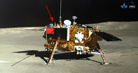View of the Chang’E 4 lander with the location of the LND sensor head indicated by the red arrow. LND is mounted in the Chang’E 4 payload compartment; the lid at the tip of the red arrow is closed at night to protect LND from the cold lunar night. Image credit: Chinese National Space Agency / National Astronomical Observatories of China.