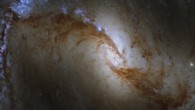 This Hubble image shows NGC 1365, a double-barred spiral galaxy 55.4 million light-years away in the constellation of Fornax. The color image is made up of observations from Hubble’s Wide Field Camera 3 (WFC3) in the ultraviolet, near-infrared, and optical parts of the spectrum. The image was made through five filters. The color results from assigning different hues to each monochromatic image associated with an individual filter. Image credit: NASA / ESA / Hubble / J. Lee / PHANGS-HST Team / Judy Schmidt, www.geckzilla.com.