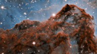 A 5-light-year-long section of the western wall in the Carina Nebula, as observed with adaptive optics on the Gemini South telescope. This mountainous section of the nebula reveals a number of unusual structures including a long series of parallel ridges that could be produced by a magnetic field, a remarkable almost perfectly smooth wave, and fragments that appear to be in the process of being sheared off the cloud by a strong wind. There is also evidence for a jet of material ejected from a newly-formed star. The exquisite detail seen in the image is in part due to a technology known as adaptive optics, which resulted in a ten-fold improvement in the resolution of the research team’s observations. Image credit: International Gemini Observatory / NOIRLab / NSF / AURA / Patrick Hartigan, Rice University / Travis Rector, University of Alaska Anchorage / Mahdi Zamani / Davide de Martin.