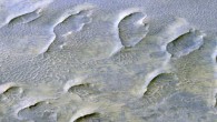 This oblique color view from the HiRISE instrument onboard NASA’s Mars Reconnaissance Orbiter shows a lithified field of sand dunes within Melas Chasma, Valles Marineris. The large degree of preserved morphology for many of these paleodunes reveals important information regarding the acting wind regime and climate prior to their cementation. Image credit: NASA / JPL / University of Arizona.