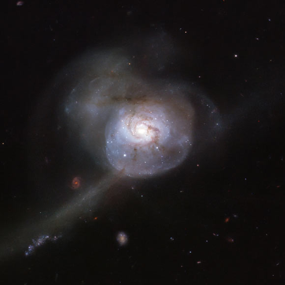 This Hubble image shows NGC 34, a spiral galaxy located 271 million light-years away in the constellation of Cetus. Image credit: NASA / ESA / Hubble / A. Adamo et al.