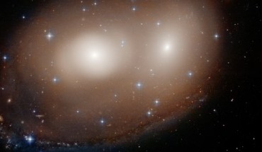 This unusual celestial object, as seen by the NASA/ESA Hubble Space Telescope, is actually a combination of two lenticular galaxies, NGC 2292 and NGC 2293. Image credit: NASA / ESA / Hubble / W. Keel, University of Alabama.
