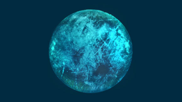 This illustration of Jupiter’s moon Europa shows how its icy surface may glow on its nightside. Image credit: NASA / JPL-Caltech.