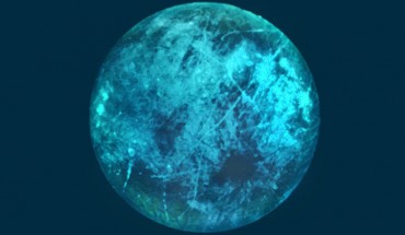 This illustration of Jupiter’s moon Europa shows how its icy surface may glow on its nightside. Image credit: NASA / JPL-Caltech.