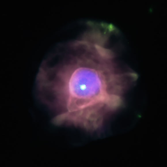 This composite image of the planetary nebula IC 4593 contains X-rays (Chandra) from gas that has been heated to over a million degrees. These high temperatures were likely generated by material that blew away from the shrunken core of the star and crashed into gas that had previously been ejected by the star. Visible light data from Hubble in the image show combinations of nitrogen, oxygen, and hydrogen. Image credit: NASA / CXC / UNAM / J. Toala et al. / STScI.