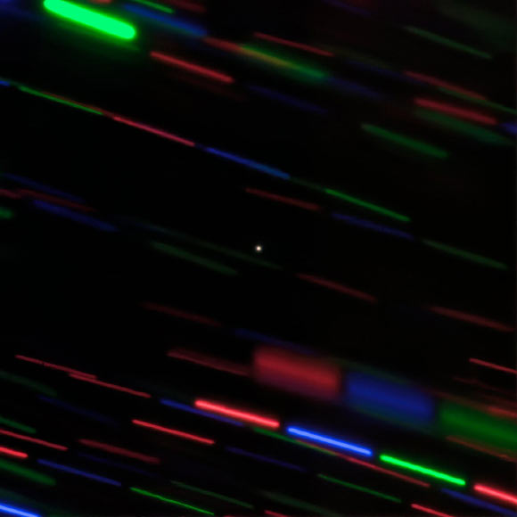 This image, taken with the 8-m Gemini North telescope on Hawaii’s Maunakea, shows Earth’s minimoon 2020 CD3 (center, point source). The image combines three images each obtained using different filters to produce this color composite. Image credit: International Gemini Observatory / NOIRLab / NSF / AURA / G. Fedorets.
