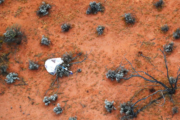 Hayabusa-2’s container with material from the near-Earth asteroid Ryugu and its parachute in South Australia. Image credit: JAXA.