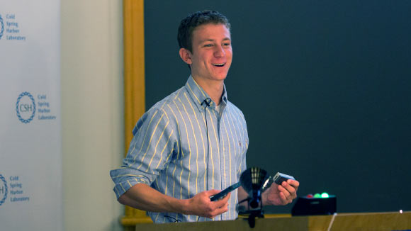 Aspyn Palatnick holding the world’s first mobile genetics laboratory at Cold Spring Harbor Laboratory’s 125th anniversary Open House. Image credit: Cold Spring Harbor Laboratory.