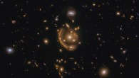 This Hubble image shows GAL-CLUS-022058-38303, the largest, nearly-complete Einstein ring known. The image is made up of observations from Hubble’s Wide Field Camera 3 (WFC3) in the infrared and optical parts of the spectrum. Three filters were used to sample various wavelengths. The color results from assigning different hues to each monochromatic image associated with an individual filter. Image credit: NASA / ESA / Hubble / Saurabh Jha, Rutgers the State University of New Jersey / L. Shatz.