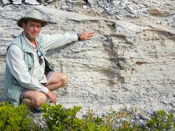 Professor Martin next to the Pleistocene iguana burrow. Image credit: Melissa Hage.
